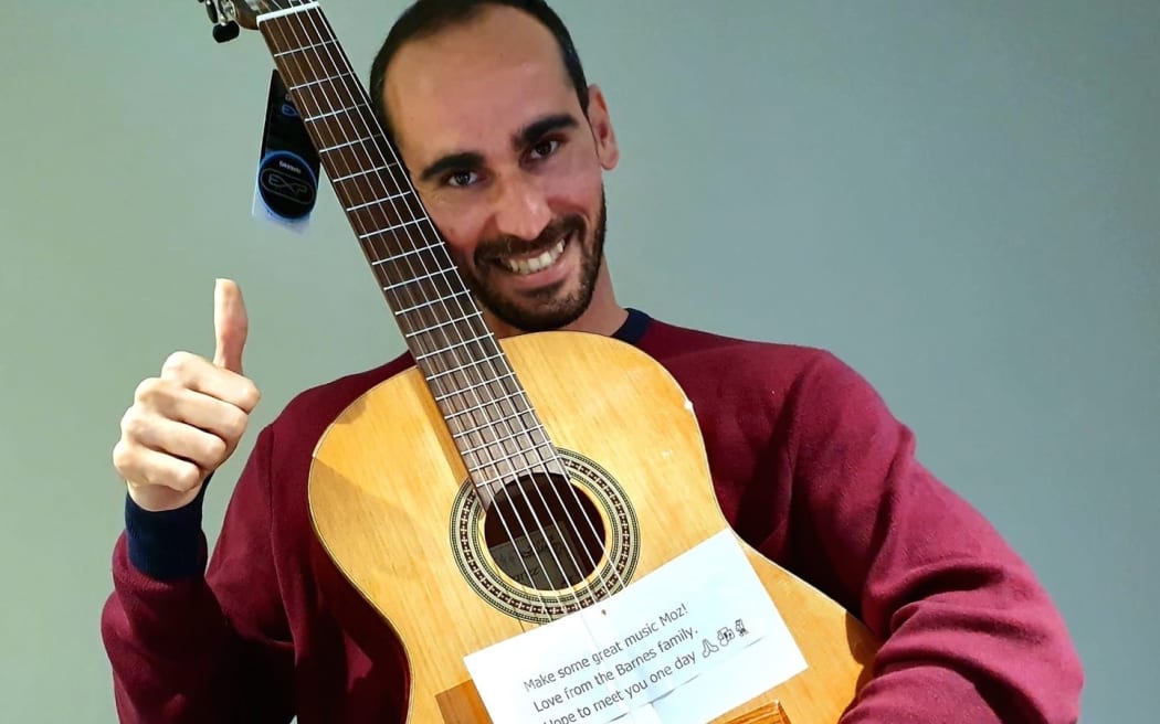 Moz with the guitar given to him by Jimmy Barnes.