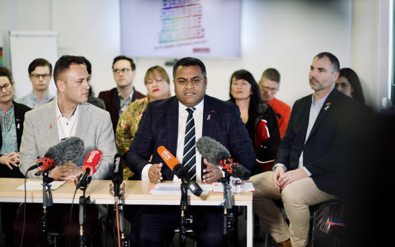 Minister Kris Faafoi addresses media.