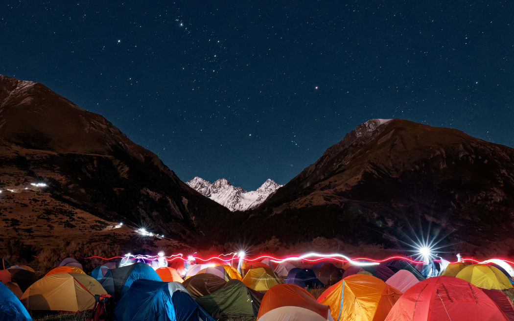 Night time descends on the campsite by Hash House where race participants rest between legs of the event.