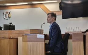 Restore Passenger Rail protester Thomas Taptiklis has told a jury in the Wellington District Court that hanging protest banners from an overbridge above a motorway was not dangerous.