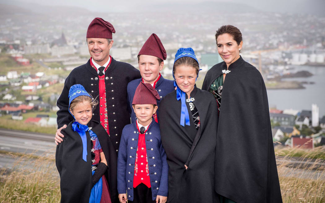 This photo taken on August 23, 2018 shows the Danish Crown Prince couple, Frederik of Denmark (L) and Mary of Denmark (R), together with their four children, Princess Isabella, Prince Christian, Prince Vincent, Princess Josephine, posing during their visit to the Argjahamri school during an official visit to the Faroe Islands, in Tórshavn. Denmarks' Queen Margrethe announced in her New Years speech that she is abdicating on February 14, 2024. Crown Prince Frederik will take her place and become King Frederik the 10th of Denmark, while Australian born Crown Princess Mary will be Queen of Denmark. (Photo by Mads Claus Rasmussen / Ritzau Scanpix / AFP) / Denmark OUT