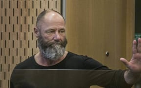 Kim Michael David Barwell waves to a supporter in court before being sentenced on 65 charges of obtaining by deception in 2018. Barwell is back to jail now on more fraud charges.