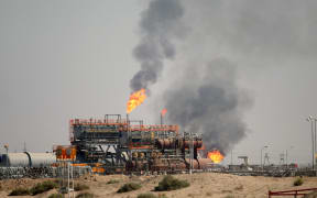 A picture taken on October 23, 2017 shows gas flares burning at the North Rumaila natural gas field, north of the southern Iraqi port of Basra.