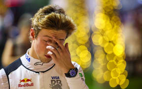 Liam Lawson of Visa Cash App RB walks in the paddock during qualifying ahead of the F1 Grand Prix of Bahrain.