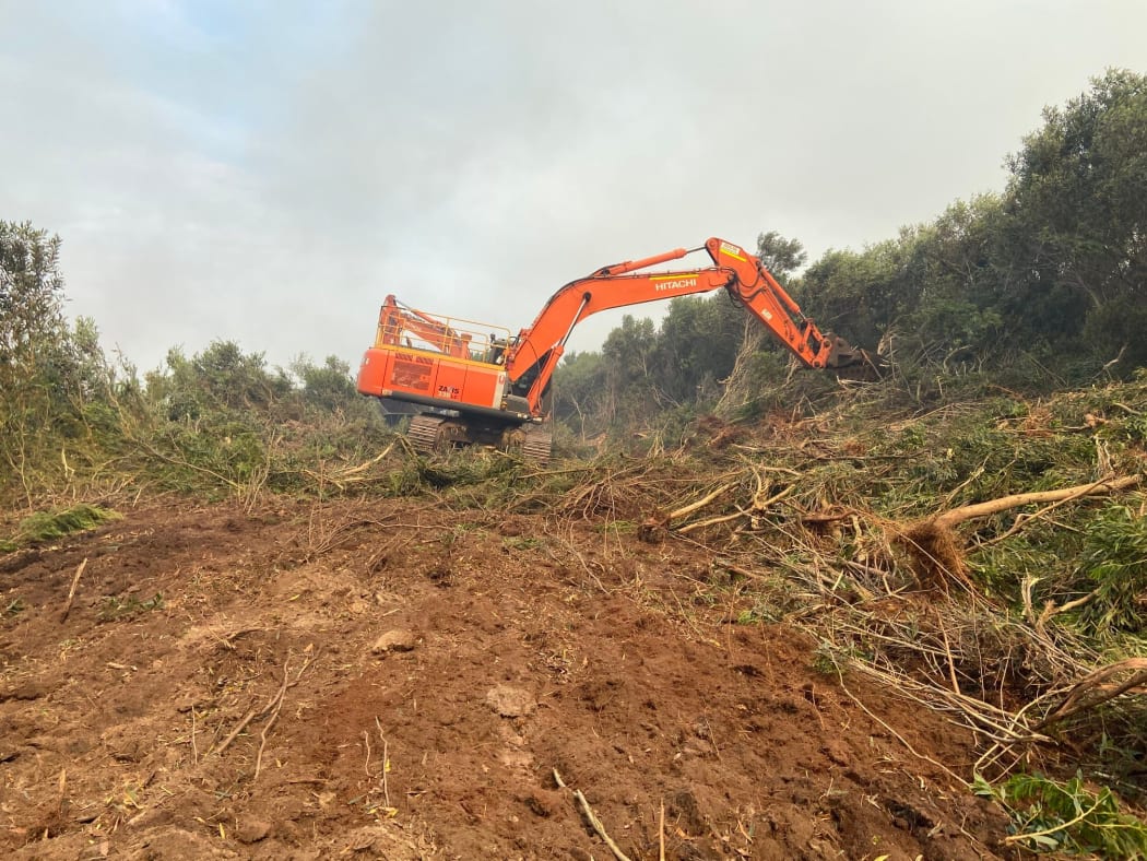 Heavy machinery was brought in to widen an existing track and create firebreaks, as well as around orchards, around Kaimaumau village on 20 December, 2021.