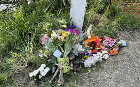 Flowers left at the scene of a fatal accident, where 3 people died, at the intersection of SH1 and Bush road in Tuamarina near Blenheim.