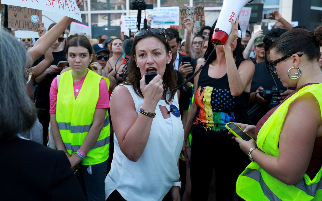 MIAMI, FLORIDA: JUNE 24: Florida Agricultural Commissioner Nikki Fried joins with people to protest the Supreme Court's decision in the Dobbs v Jackson Women's Health case on June 24, 2022 in Miami, Florida. The Court's decision in the Dobbs v Jackson Women's Health case overturns the landmark 50-year-old Roe v Wade case, removing a federal right to an abortion.   Joe Raedle/Getty Images/AFP (Photo by JOE RAEDLE / GETTY IMAGES NORTH AMERICA / Getty Images via AFP)