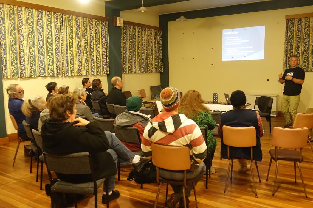 Phil McCabe talks to a small group of supporters in New Plymouth last night.