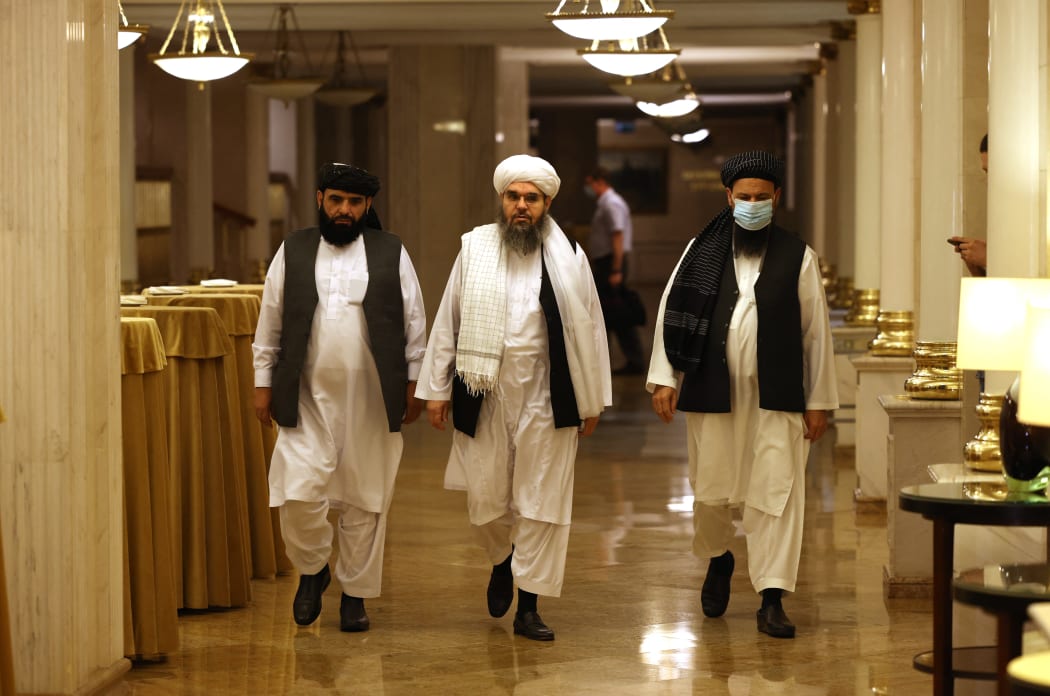 Leaders of the Taliban movement walk to attend a press conference in Moscow on 9 July 2021. - Russia on July 9, 2021, said the Taliban controls about two-thirds of the Afghan-Tajik border and urged all sides in Afghanistan to show restraint.