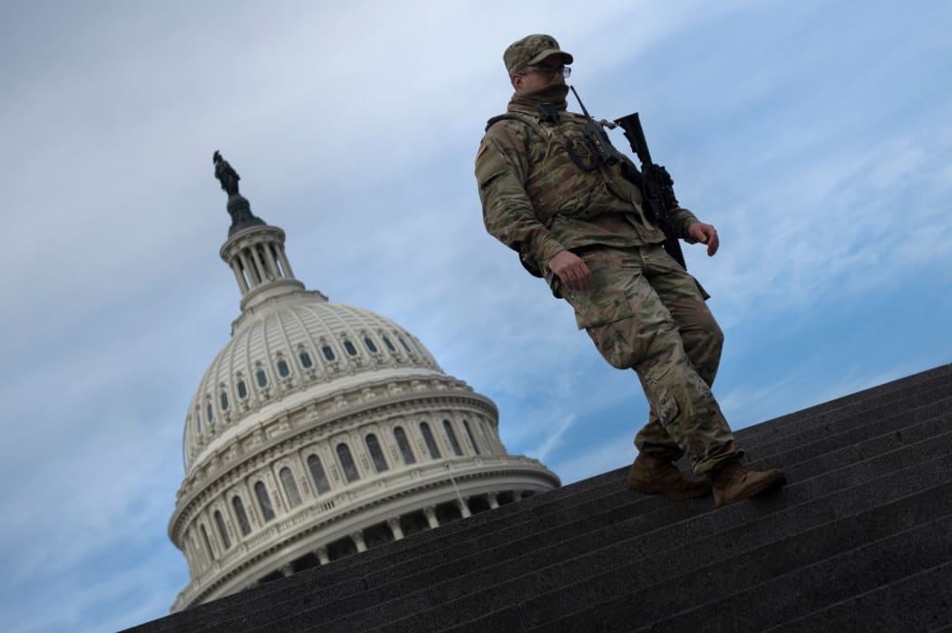 A member of the National Guard provides security at the US Capitol on January 14, 2021, in Washington, DC, a week after supporters of US President Donald Trump attacked the Capitol, and ahead of the inauguration of President-elect Joe Biden on January 20.