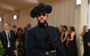 Puerto Rican singer Bad Bunny arrives for the 2024 Met Gala at the Metropolitan Museum of Art on May 6, 2024, in New York. The Gala raises money for the Metropolitan Museum of Art's Costume Institute. The Gala's 2024 theme is “Sleeping Beauties: Reawakening Fashion.” (Photo by Angela WEISS / AFP)