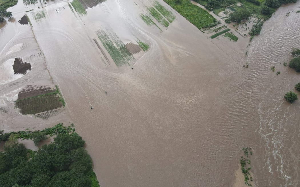 Flood in central New Caledonian plains affecting crops.