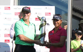 John Key presents Lydia Ko with the trophy.