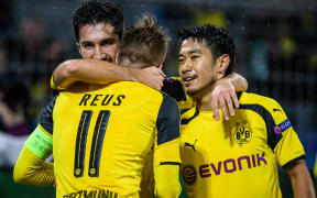 Dortmund, Germany. UEFA Champions League football, Borussia Dortmund. Nuri Sahin (Dortmund) celebrates his goal with Marco Reus (Borussia Dortmund 11) and Shinji Kagawa.