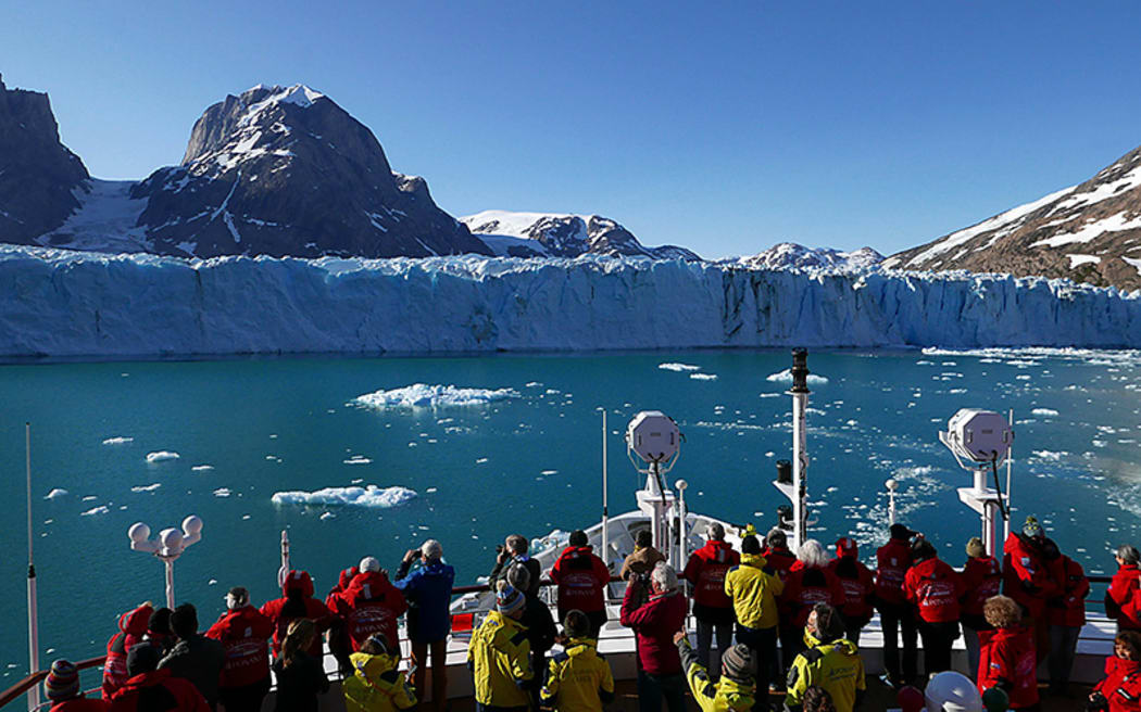 Ship approaching glacier in Skjoldungen Fjord