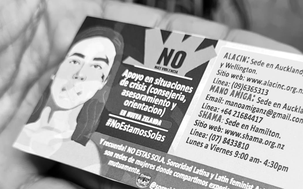 Cards with helplines being distributed to mark International Day for Elimination of Violence against Women in Auckland.