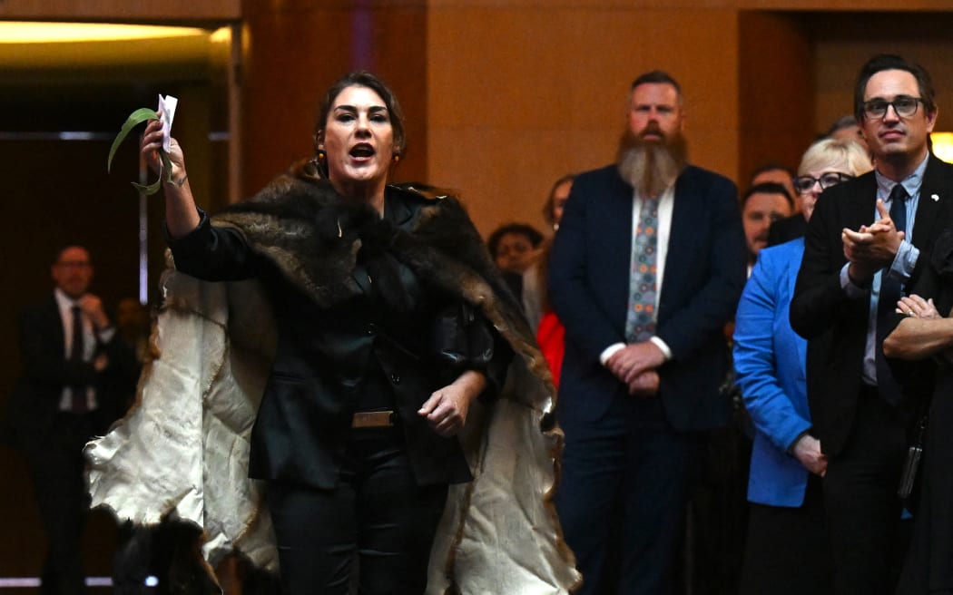 Australian Senator Lidia Thorpe disrupts proceedings as Britain's King Charles III and Queen Camilla attend a Parliamentary reception at Parliament House in Canberra on October 21, 2024. (Photo by LUKAS COCH / POOL / AFP)