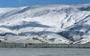 Snow covered hills at Matakanui Station, Omakau, Central Otago.