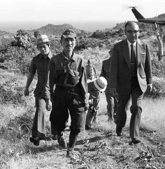Hiroo Onoda (second left) was finally persuaded to leave the jungle in 1974.