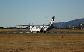 An Air New Zealand turboprop plane prepares for takeoff from Nelson Airport.