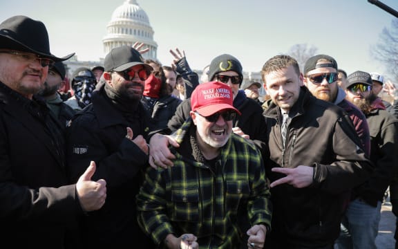 WASHINGTON, DC - FEBRUARY 21: (L-R) Stewart Rhodes, Enrique Tarrio, Joe Biggs and Zach Rehl, members of the far-right group the Proud Boys, rally outside the U.S. Capitol following a news conference on February 21, 2025 in Washington, DC. The news conference was held in the same area where thousands of supporters of President Donald Trump attacked the U.S. Capitol on January 06, 2021 in an attempt to halt the certification of former President Joe Biden's election victory. In one of the first acts of his second term, Trump pardoned nearly 1,600 people charged and convicted of crimes related to the assault.   Chip Somodevilla/Getty Images/AFP (Photo by CHIP SOMODEVILLA / GETTY IMAGES NORTH AMERICA / Getty Images via AFP)