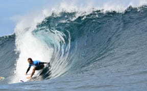 New Zealand's Billy Stairmand drops into a wave in the 5th heat of the men's surfing round 1, during the Paris 2024 Olympic Games, in Teahupo'o, on the French Polynesian Island of Tahiti, on July 27, 2024.
