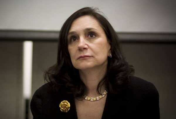 Dr Sherry Turkle wears a black blazer and a gold necklace and has shoulder length dark h air.