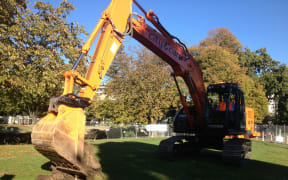Gerry Brownlee using a digger to turn the first sod for the Avon River precinct.
