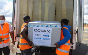 Workers load boxes of Oxford/AstraZeneca Covid-19 vaccines, part of the the Covax programme, into a truck after they arrived by plane at the Ivato International Airport in Antananarivo, Madagascar, on May 8, 2021.