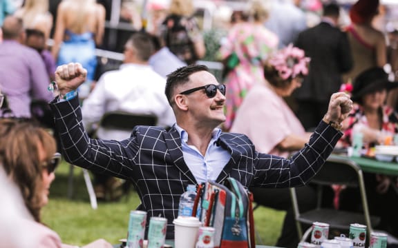 Crowds excited for New Zealand Trotting Cup at Addington Raceway in Christchurch.