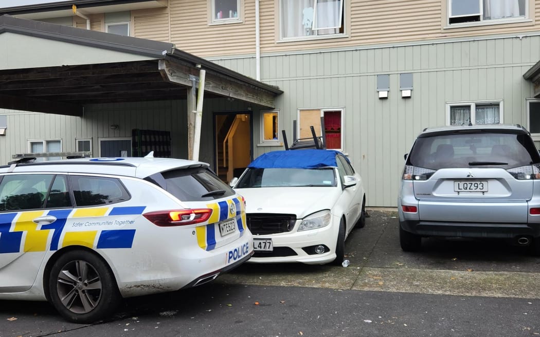 Police in front of smashed up Ōtāhuhu house.