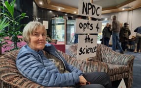 Pip Abernethy after being ejected from the New Plymouth District Council chamber after waving a pro-fluoride sign.