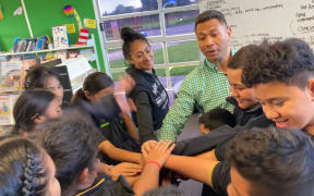 Ex-All Black Pita Alatini and award-winning hip hop dancer, Mele Tapueluelu running a leadership session at Wymondley Road School in Ōtara.