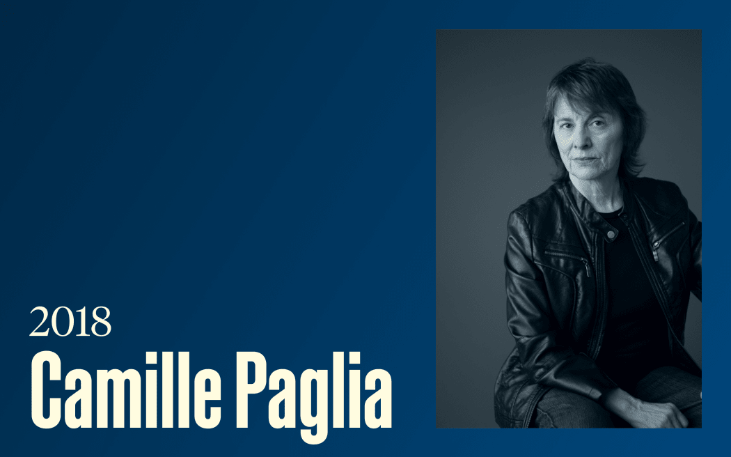 A serious looking woman poses in a leather jacket, text reads "2018, Camille Paglia"