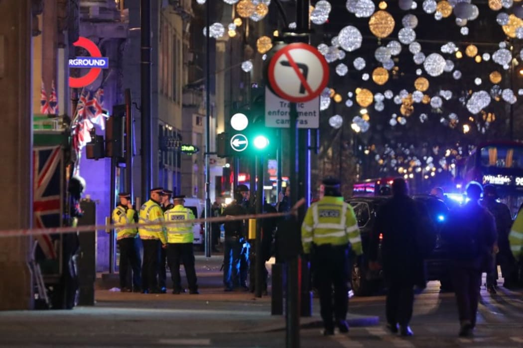 Police outside Oxford Circus underground station during the response.