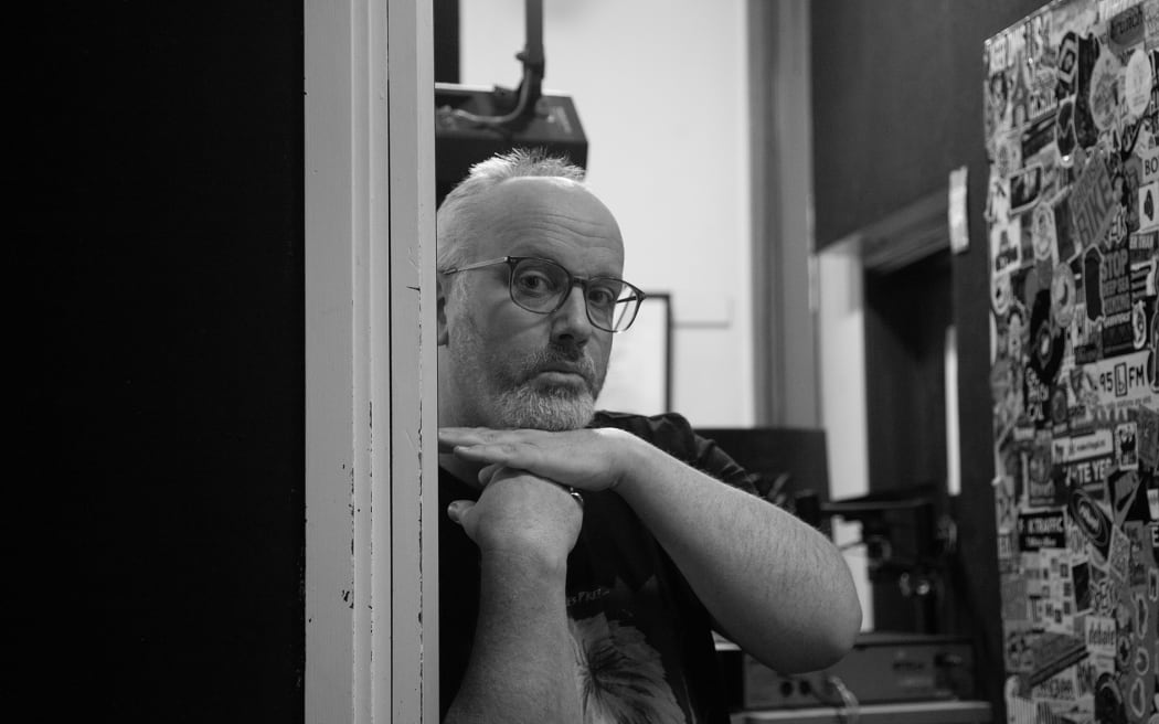 Black-and-white image of promoter Matt Crawley at Auckland alternative radio station 95bFM.