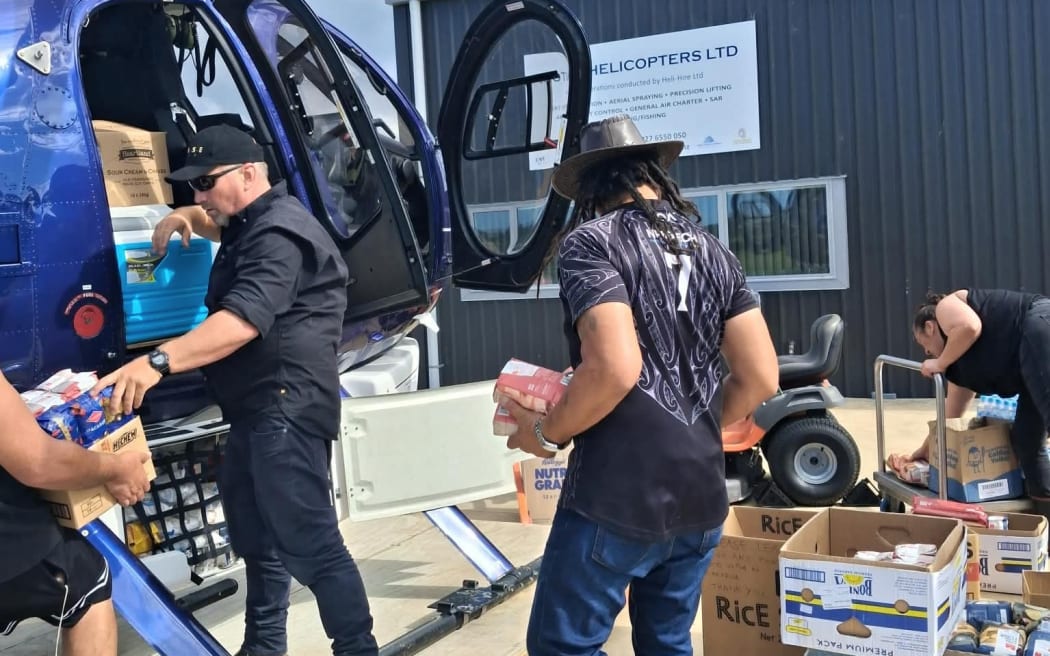 Steven Woods from Motu Helicopters loading up essential supplies from Opotiki to be delivered to Te Araroa.