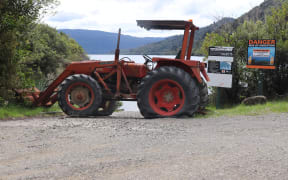 Tractor blocking entrance to Lake Waikaremoana.