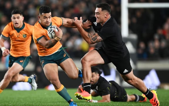 Hunter Paisami (L) gets past Codie Taylor.
New Zealand All Blacks v Australia Wallabies. Bledisloe Cup rugby union test match. Eden Park, Auckand, New Zealand. Saturday 7 August 2021.