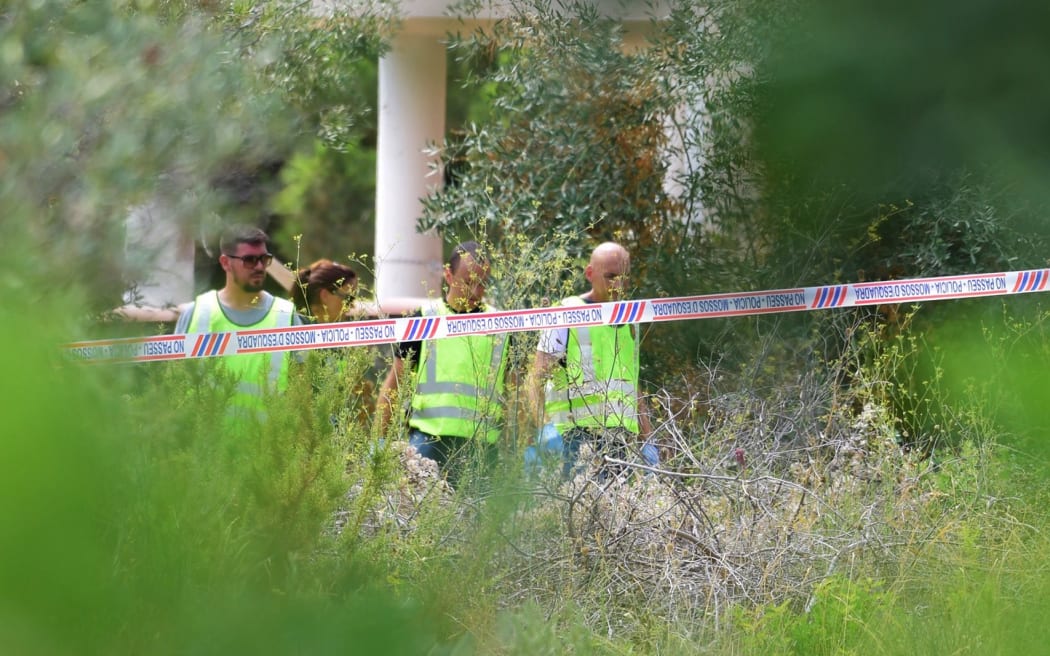 Police officers investigate the rubble of a house in Alcanar, where suspects of this week's twin assaults in Spain were believed to be building bombs.