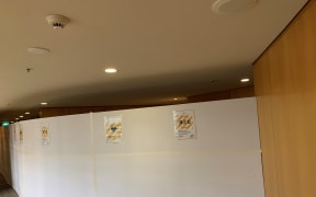 A divider has been installed at Stamford Plaza Hotel to separate those in managed isolation from residents in the building.