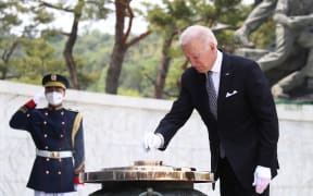 US President Joe Biden participates in a wreath laying ceremony in honour of those who died in the Korean War at the National Cemetery in Seoul on May 21, 2022. (Photo by Chung Sung-Jun / POOL / AFP)