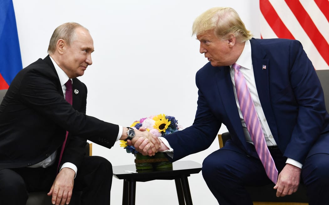 (FILES) US President Donald Trump (R) attends a meeting with Russia's President Vladimir Putin during the G20 summit in Osaka on June 28, 2019. US President Donald Trump and Russian counterpart Vladimir Putin could meet for a summit as early as next week, the Kremlin said on August 7, 2025. The meeting would be the first between a sitting US and Russian president since Joe Biden met Putin in Geneva in June 2021, and comes as Trump seeks to broker an end to Russia's military assault on Ukraine. (Photo by Brendan Smialowski / AFP)