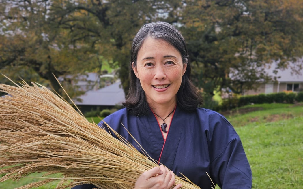 Yuki Fukada at her rice patch in Nelson
