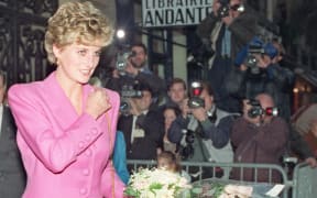 In this file photo taken on 14 November 1992 Princess Diana leaves a bookshop in Paris.