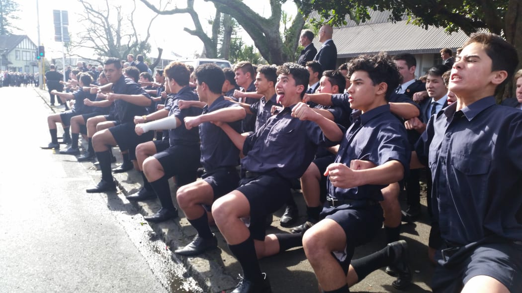 Boys from Auckland Grammar perform a haka at Sir John Graham's funeral.