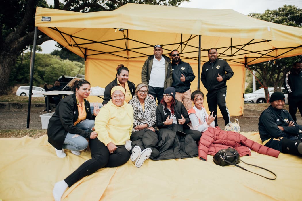 Valavia Sheik (wearing yellow hoodie) says  for her suporting Wellington Nadroga FC in the New Zealand Fiji Football Association Wellington tournaments is about family, community and representing Fiji.