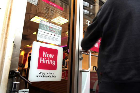 A sign in a store window in New York.