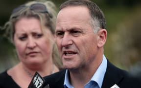 John Key talking to reporters in the Manawatu Gorge on 18 September, 2014