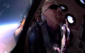 Billionaire Sir Richard Branson has successfully reached the edge of space on board his Virgin Galactic rocket plane.